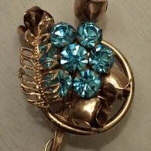 Blue Crystal and Rose Goldtone Brooch